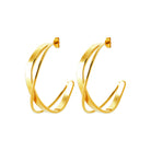 Boucles d’oreilles créoles croisées en acier PVD doré
