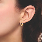 Boucles d’oreilles créoles gravées de triangles en plaqué or