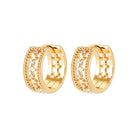 Boucles d’oreilles créoles larges ajourées à rangs de zircons en plaqué or