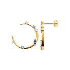 Boucles d’oreilles créoles ouvertes ponctuées de pierres bleues grand modèle en plaqué or