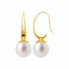 Boucles d’oreilles pendantes fil effilé et grosse perle d’imitation en acier PVD doré