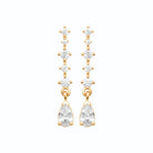 Boucles d’oreilles pendantes ligne de zircons baguettes et poire en plaqué or