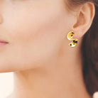 Boucles d’oreilles volutes sculptées en acier PVD doré