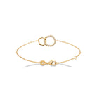 Bracelet deux anneaux entrelacés en plaqué or et zircons