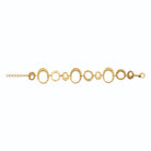 Bracelet anneaux martelés ronds et ovales en acier PVD doré