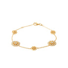 Bracelet chaîne à trois médaillons fleuris ajourés en plaqué or
