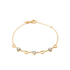 Bracelet chaîne cœurs ajourés et cœurs sertis en plaqué or
