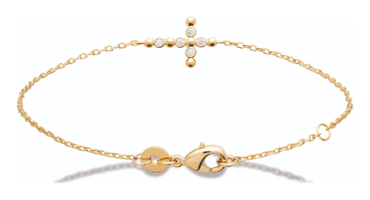 Bracelet chaîne fine à croix sertie de zircons en plaqué or