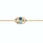Bracelet chaîne fine amande de pierres bleues et zircons en plaqué or