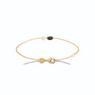 Bracelet chaîne fine cercle de zircons et pierre noire en plaqué or