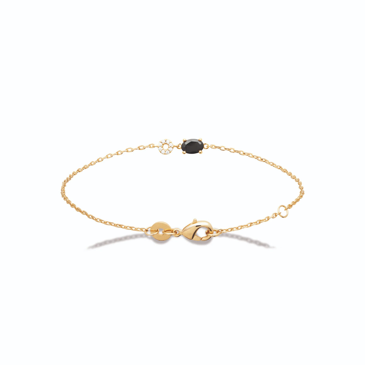 Bracelet chaîne fine cercle de zircons et pierre noire en plaqué or