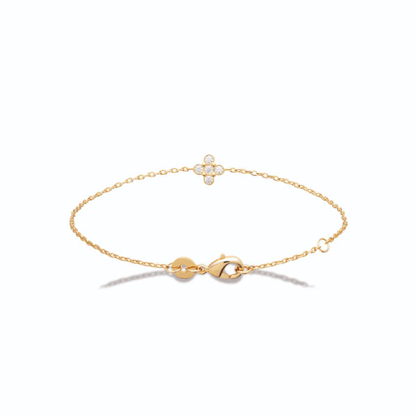 Bracelet chaîne fine fleur de cinq zircons sertis clos en plaqué or