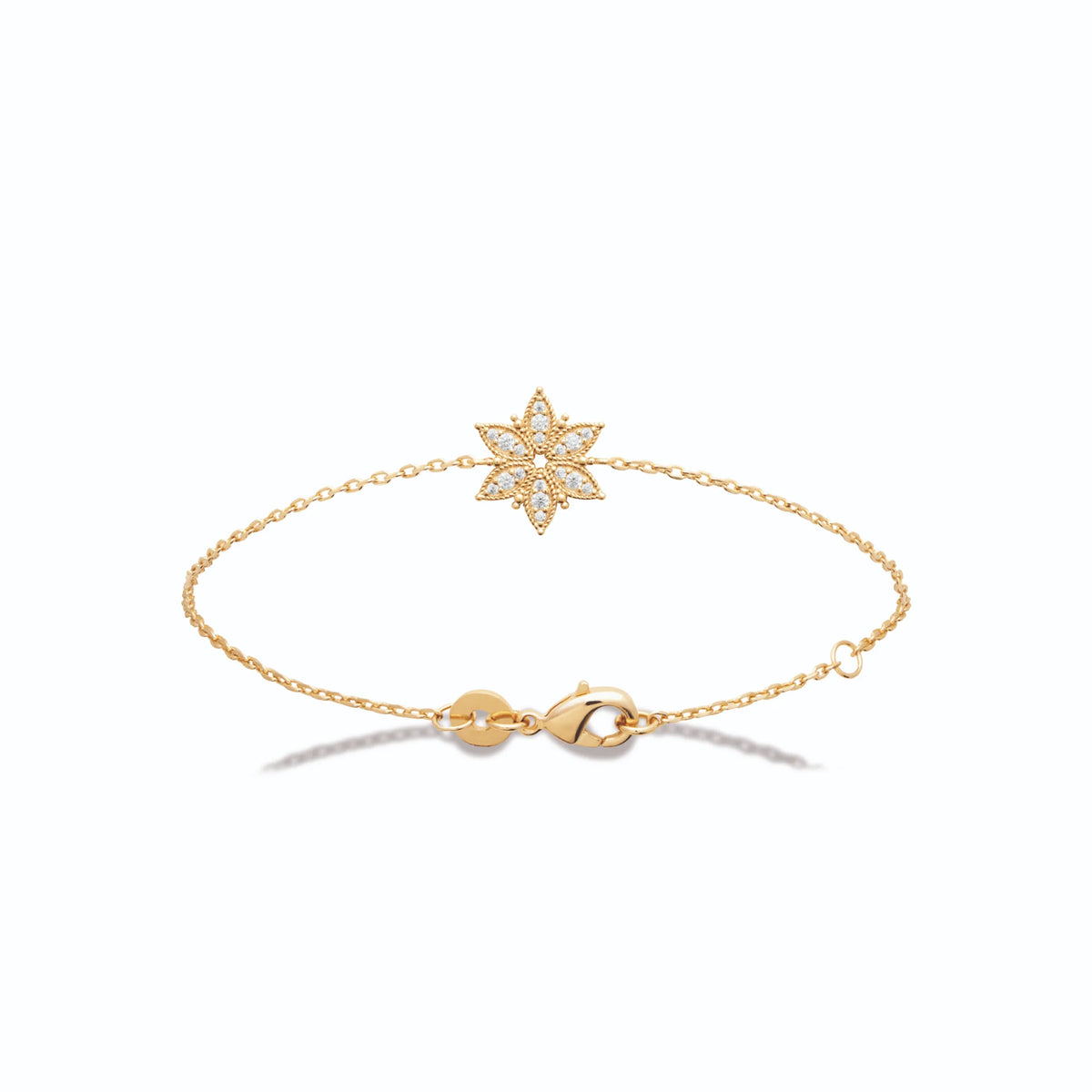 Bracelet chaîne fine fleur étoilée pavée de zircons en plaqué or