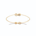 Bracelet chaîne fine infini torsadé et pierre bleu-vert en plaqué or