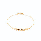 Bracelet chaîne fine ligne de billes dorées variées en plaqué or