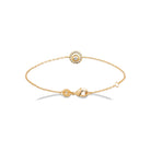 Bracelet chaîne fine médaillon rond serti de zircons en plaqué or