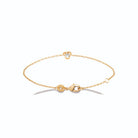 Bracelet chaîne fine nœud à trois boucles et zircon en plaqué or