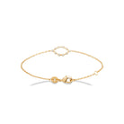 Bracelet chaîne fine ovale ajouré de zircons sertis clos en plaqué or