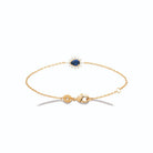 Bracelet chaîne fine pierre bleue poire et halo rayonnant en plaqué or
