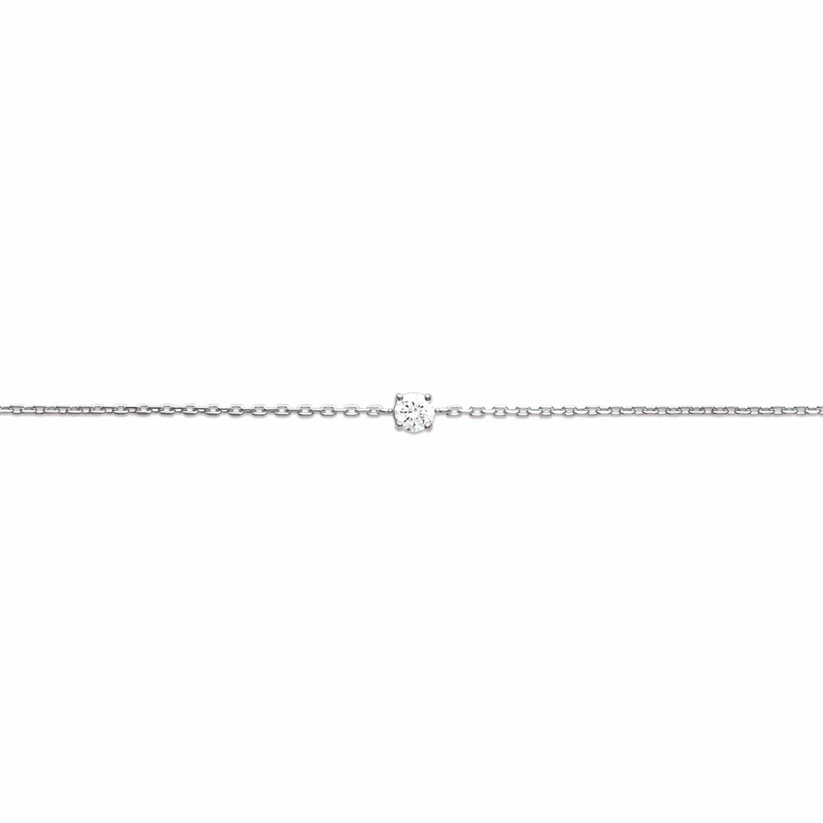Bracelet chaîne fine et solitaire zircon quatre griffes en argent 925, posé à plat sur toute sa longueur