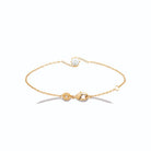Bracelet chaîne fine vague de zircons autour d’une pierre ronde en plaqué or