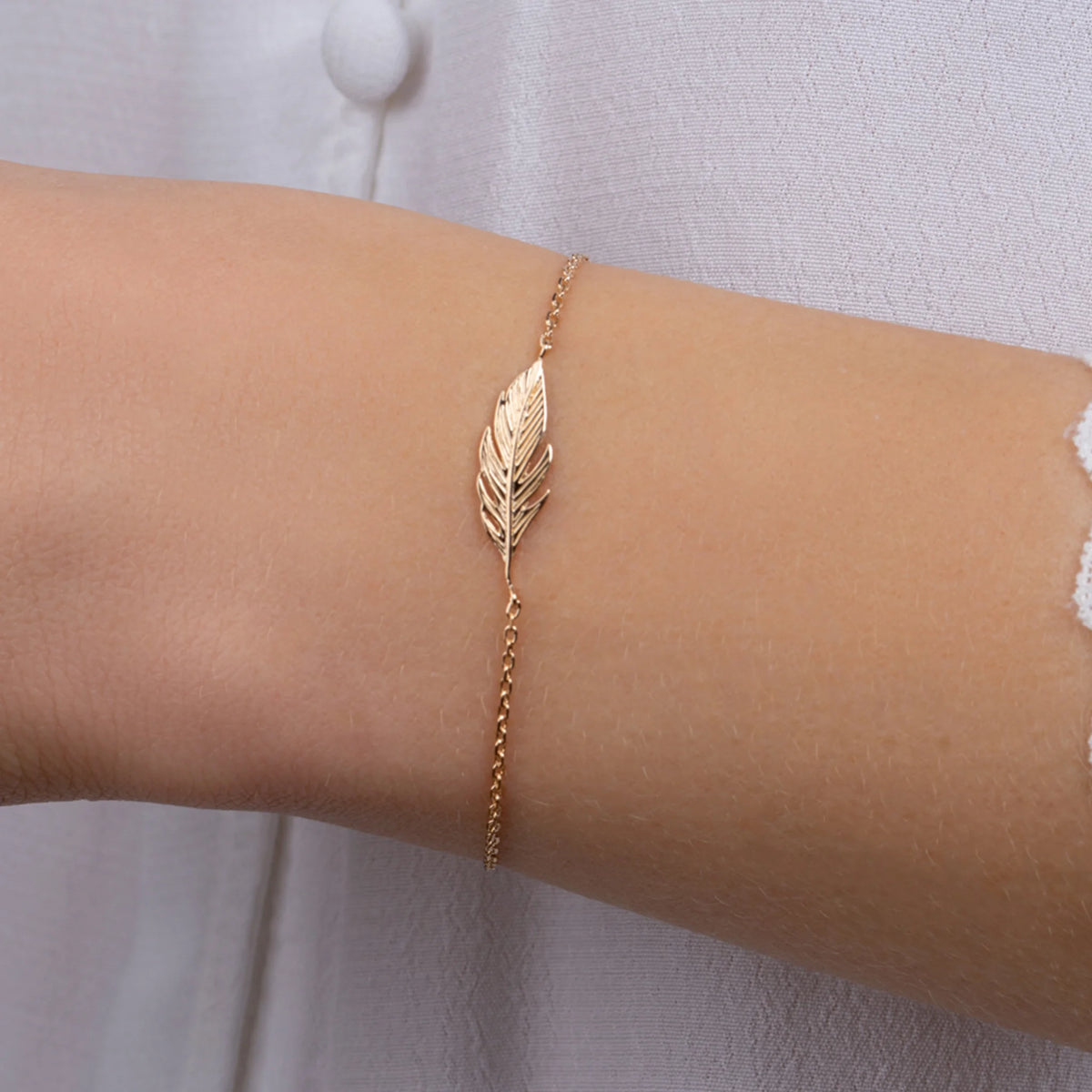 Bracelet chaîne plume en plaqué or