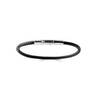 Bracelet cuir tressé fin noir et fermoir acier vu de profil