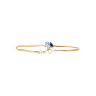 Bracelet demi-jonc grappe de pierres bleues et zircons en plaqué or