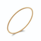 Bracelet jonc fil torsadé en plaqué or