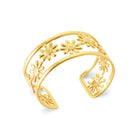 Bracelet jonc ouvert ajouré à marguerites en acier PVD doré