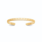 Bracelet jonc ouvert ciselé en relief en plaqué or