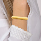 Bracelet jonc ouvert côtelé en acier PVD doré