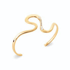 Bracelet jonc ouvert sinueux et zircons en plaqué or
