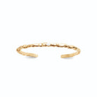 Bracelet jonc ouvert texturé façon branche et zircons en plaqué or
