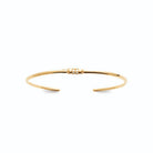 Bracelet jonc ouvert très fin à embout serti de zircons en plaqué or
