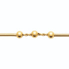 Bracelet maille serpent et trois billes en acier PVD doré