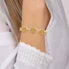 Bracelet maillons ovales cordés en acier PVD doré