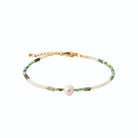 Bracelet perles vertes et blanches et perle centrale en acier PVD doré