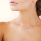 Collier deux anneaux entrelacés en argent 925 et zircons