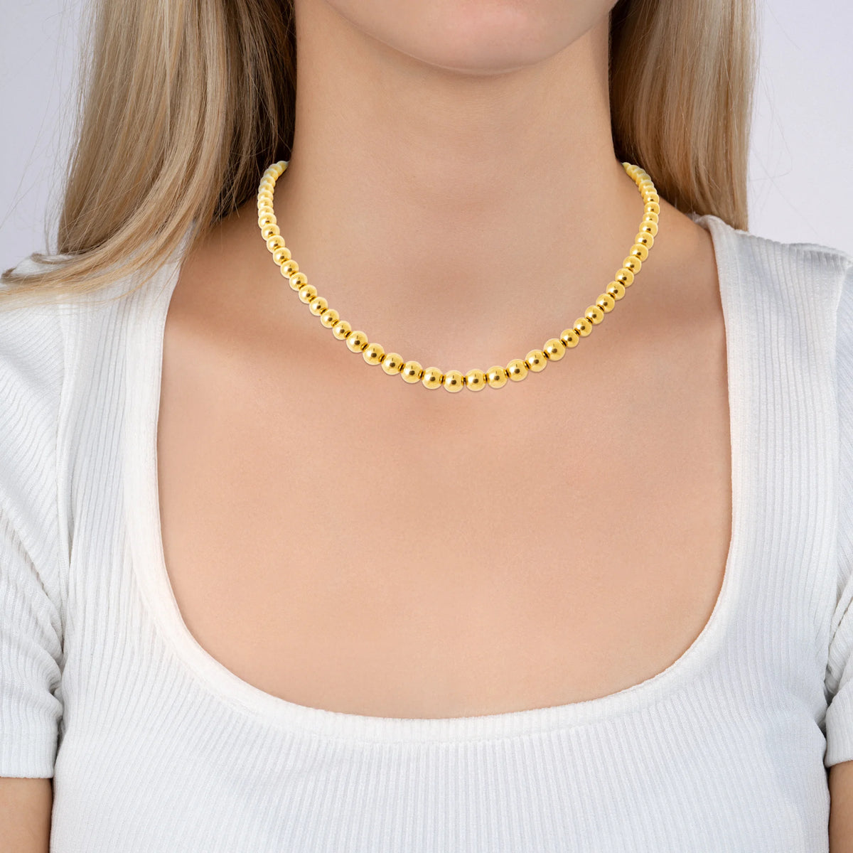 Collier chaîne de billes ras du cou en acier doré