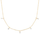 Collier chaîne à pampilles de zircons baguettes et poire en plaqué or