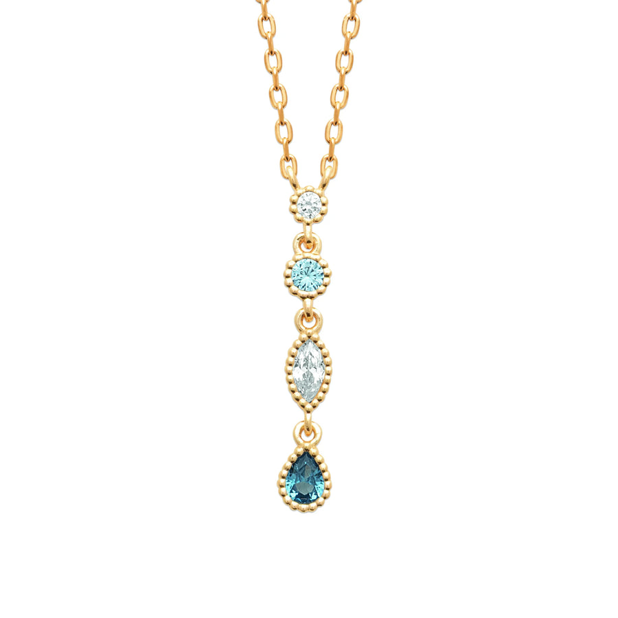 Collier chute de zircons et pierres bleues sertis clos en plaqué or, porté