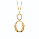 Collier deux anneaux ovales cerclés de perles en acier doré