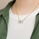 Collier double chaîne forçat et anneaux entrelacés en acier doré et argenté