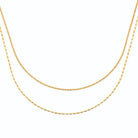 Collier double rang chaîne fine et mailles grain de riz en acier doré