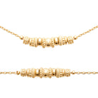 Collier chaîne fine et perles de métal ciselées en plaqué or