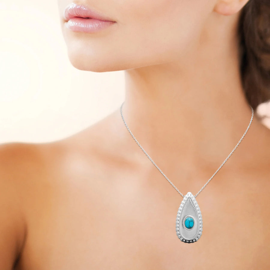 Collier goutte striée et cabochon bleu turquoise en acier argenté, porté