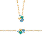 Collier grappe de pierres bleues et vertes en plaqué or