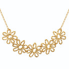 Collier guirlande de fleurs ajourées en fil texturé en acier doré
