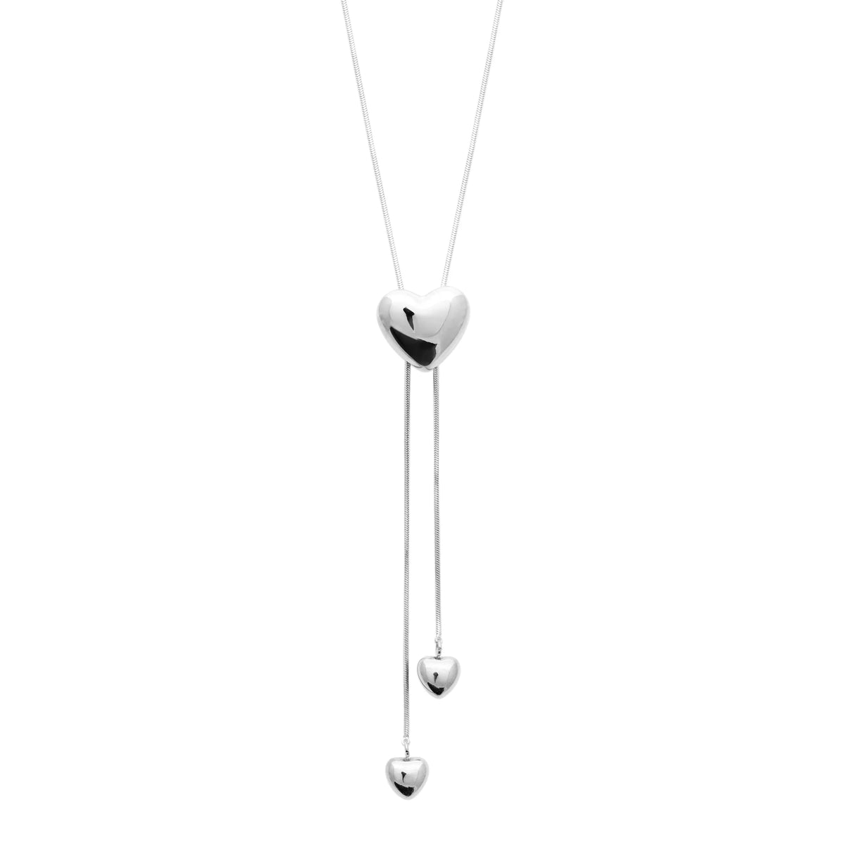 Collier lasso en acier argenté, cœur bombé coulissant et deux chaînettes à petits cœurs